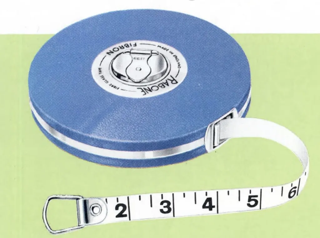 Close-up of a vintage blue Rabone Fibron measuring tape with white fiberglass tape extended, showing black inch markings and metal loop end.