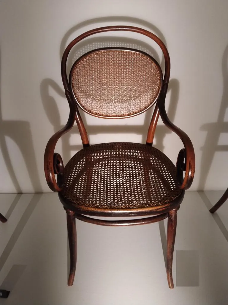 Thonet armchair model no. 11 in solid bent beech with cane seat and backrest, brown stained, designed by Gebrüder Thonet around 1855, produced by Gebrüder Thonet circa 1865.