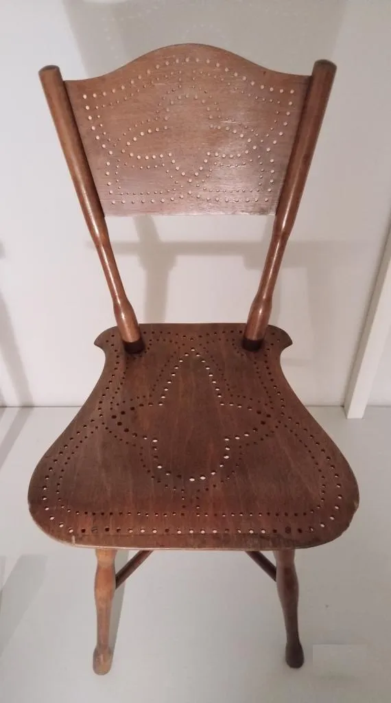 Thonet chair model no. 110 in turned beech with perforated plywood seat and backrest, brown stained, designed by Gebrüder Thonet in 1891, produced around 1900.