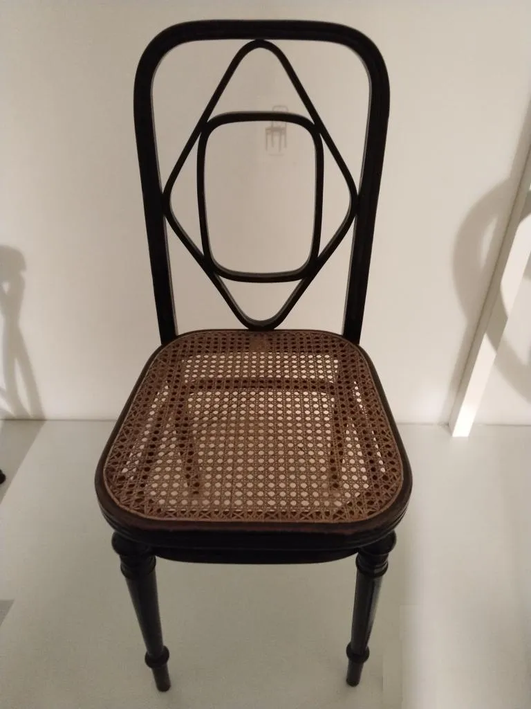 Thonet chair model no. 34 in solid bent and turned beech with cane seat, black stained, designed by Gebrüder Thonet in 1883 and produced around 1890.