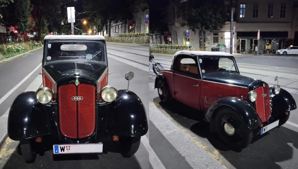 Oldtimer DKW F8 Cabriolet in Rot und Schwarz bei Nacht in einer Stadtstraße in Wien geparkt, mit sichtbaren Straßenbahnschienen im Hintergrund.